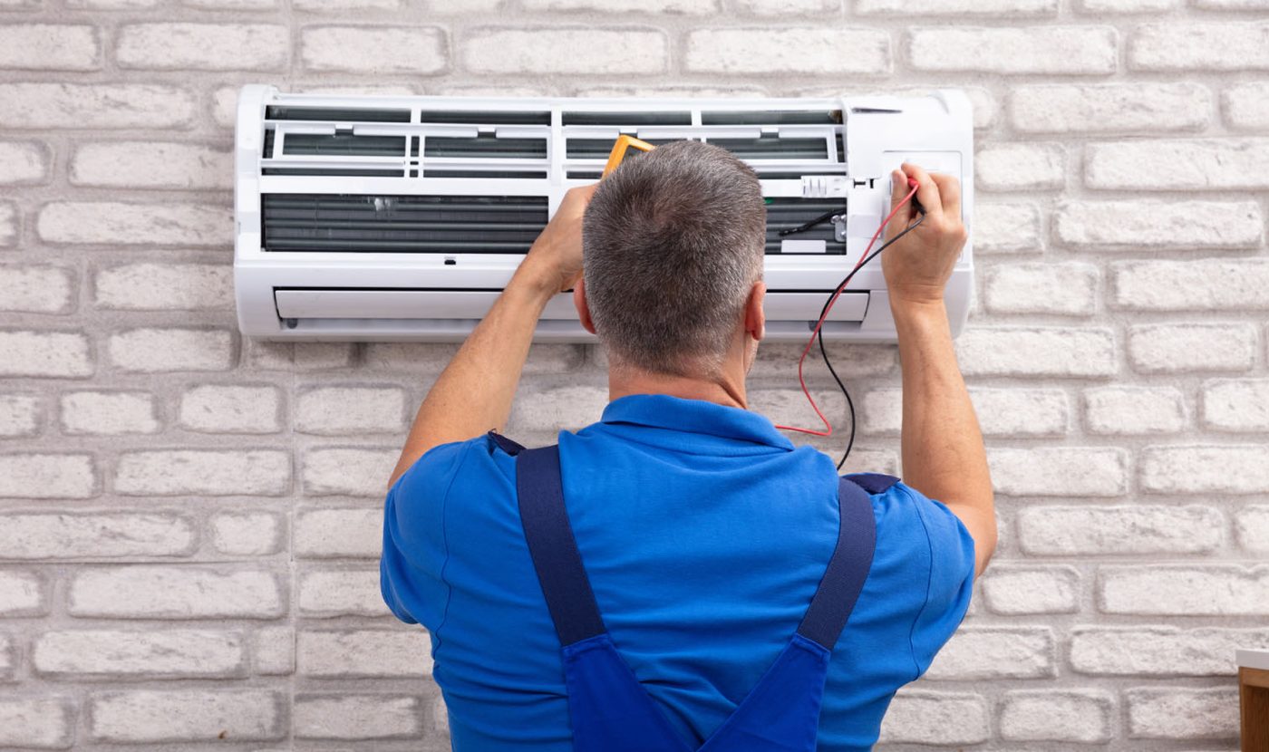 AceComfort technician servicing ductless mini-split in Vancouver